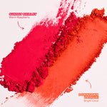 Two shades of red makeup swatches labeled 'Sunset Shirley' and 'Downtown Daiquiri' on a white background. [Downtown Daiquiri x Toni Bravo, Sunset Shirley x Toni Bravo]