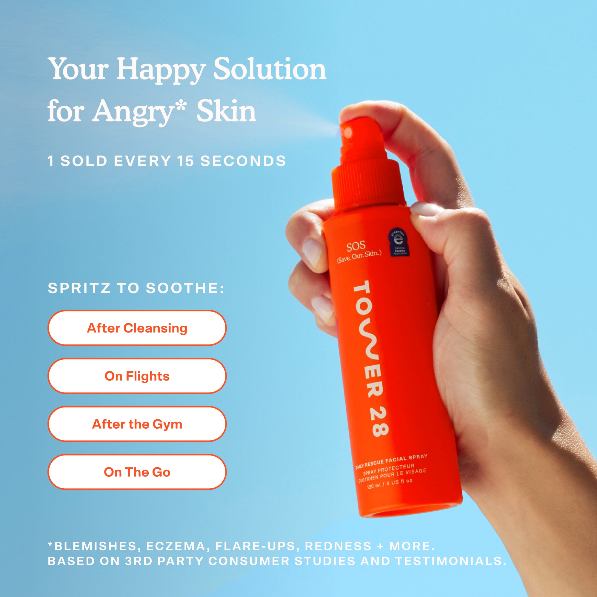 Orange spray bottle labeled 'Tower 28' held by a hand against a blue sky background [Shared]
