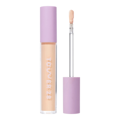Tower 28 Beauty Swipe Serum Concealer in the shade 5.0 EP, shown with the tube standing upright next to the open applicator wand to reveal the product. [5.0 EP]
