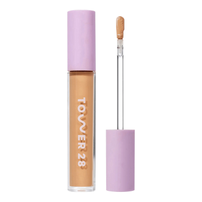Tower 28 Beauty Swipe Serum Concealer in the shade 11.0 OC, shown with the tube standing upright next to the open applicator wand to reveal the product. [11.0 OC]